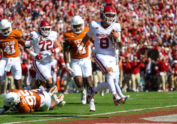 Oklahoma Sooners quarterback Dillon Gabriel (No. 8) rushes in for a touchdown against the Texas Longhorns in the Red River Showdown at the Cotton Bowl in Dallas, Texas